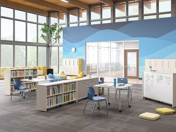 Open space outside of a classroom featuring Storyline bookcases and Build tables as a place for students to study.
