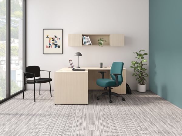 Private office shown with a light laminate desk and a teal Altern task chair 