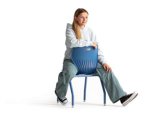 One seated student on a blue monotone Smartlink chair. One seated student on a blue monotone Smartlink chair. One seated student on a blue monotone Smartlink chair. One seated student on a blue monotone Smartlink chair. One seated student on a blue monoto