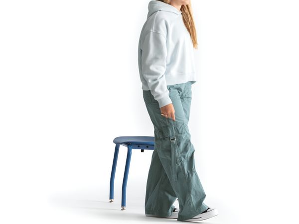 One seated student on a blue monotone Smartlink chair. One seated student on a blue monotone Smartlink chair. One seated student on a blue monotone Smartlink chair. One seated student on a blue monotone Smartlink chair. One seated student on a blue monoto