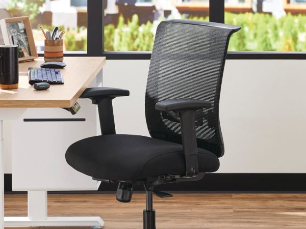 Two white Coordinate Height-Adjustable Bases paired with Coze desk tops and Convergence Task chairs in a small office setting