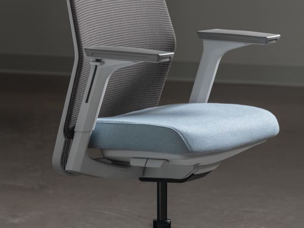 Side view of a modern task chair featuring a gray mesh backrest, light blue upholstered seat cushion, adjustable armrests, and a five-star caster base.
