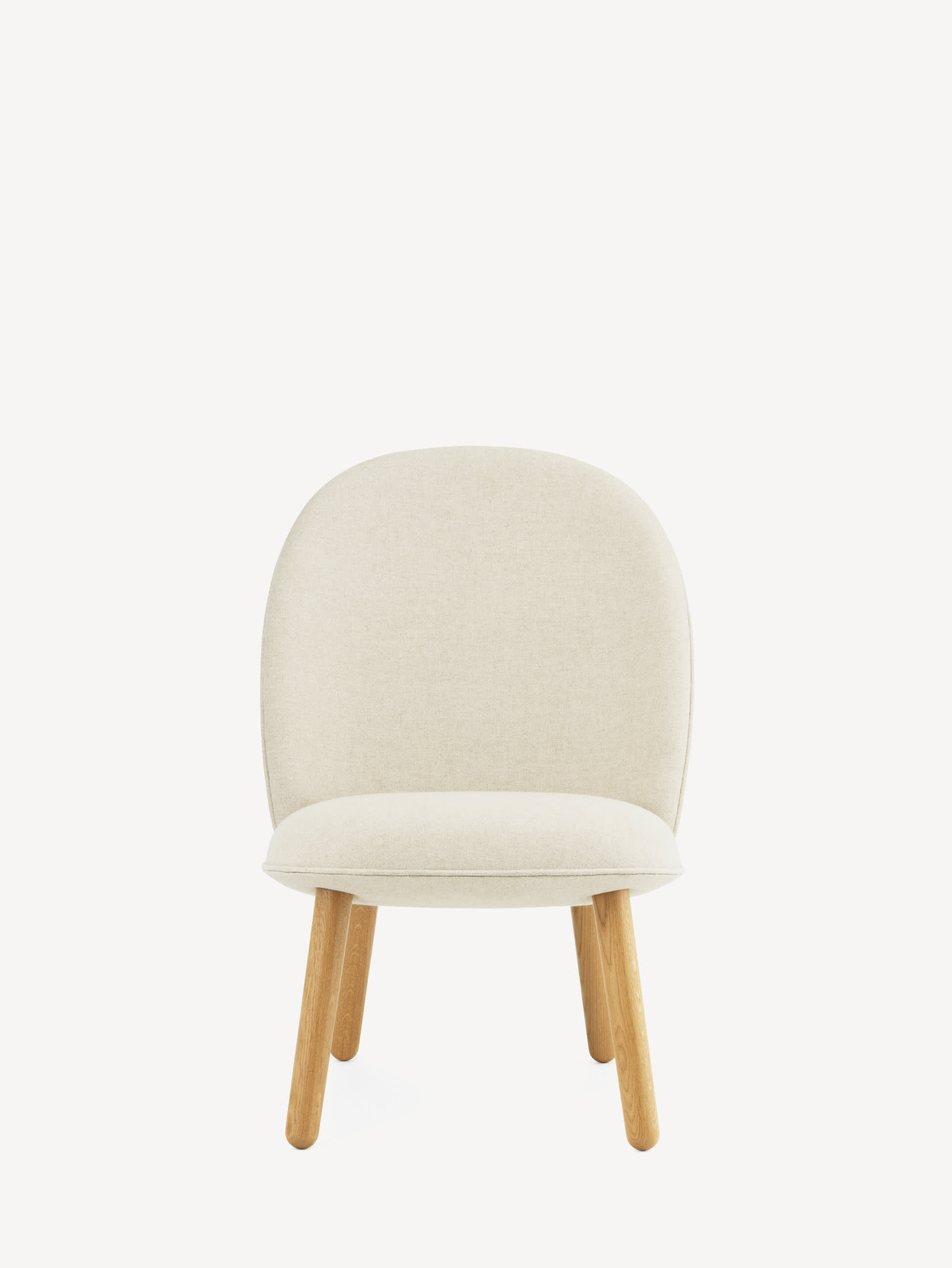 Front view of the Normann Copenhagen Ace lounge chair with light wood legs and off-white upholstery.