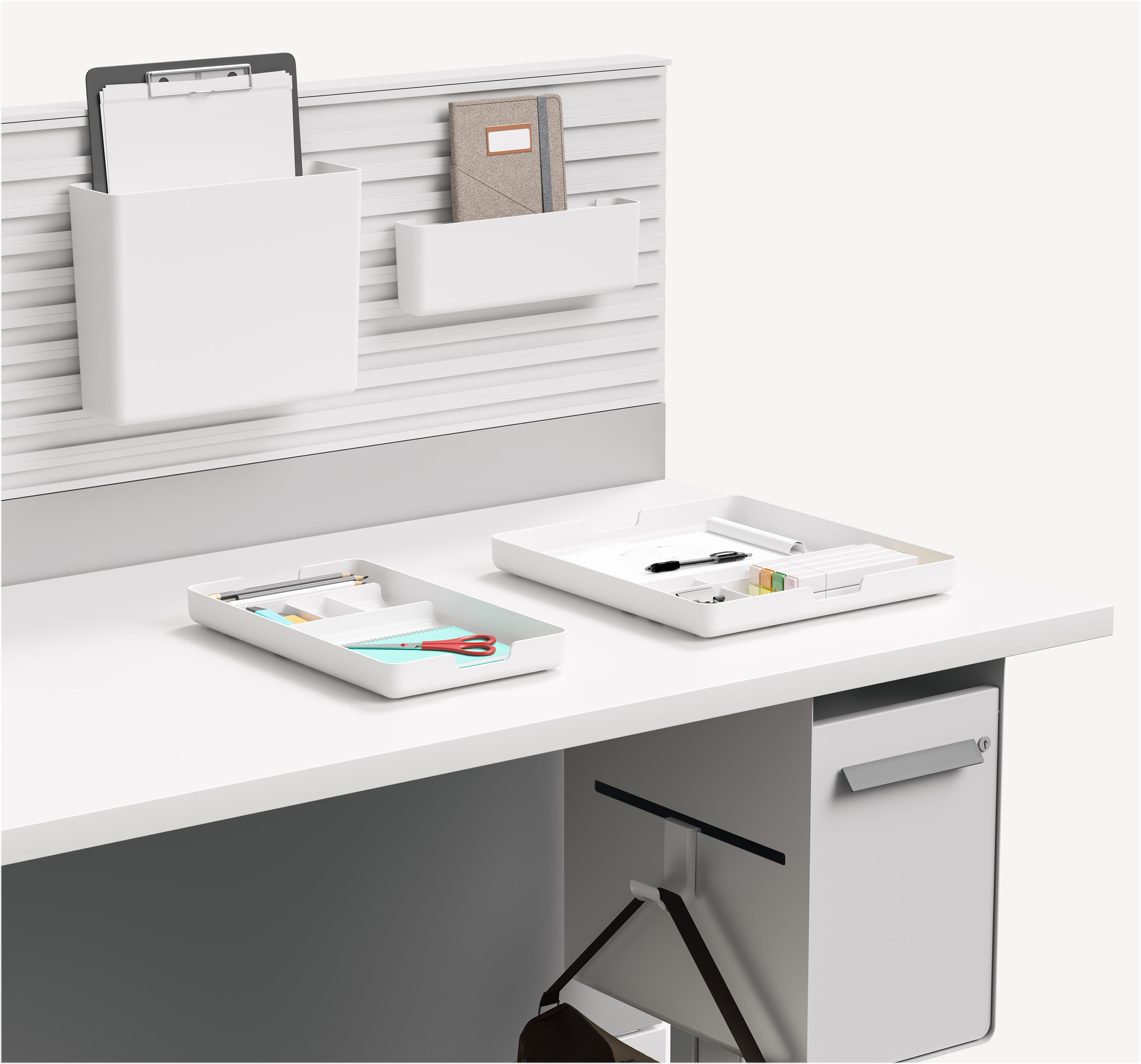 Modern workstation storage including paper file, paper tray, organization bins, and bag hook.