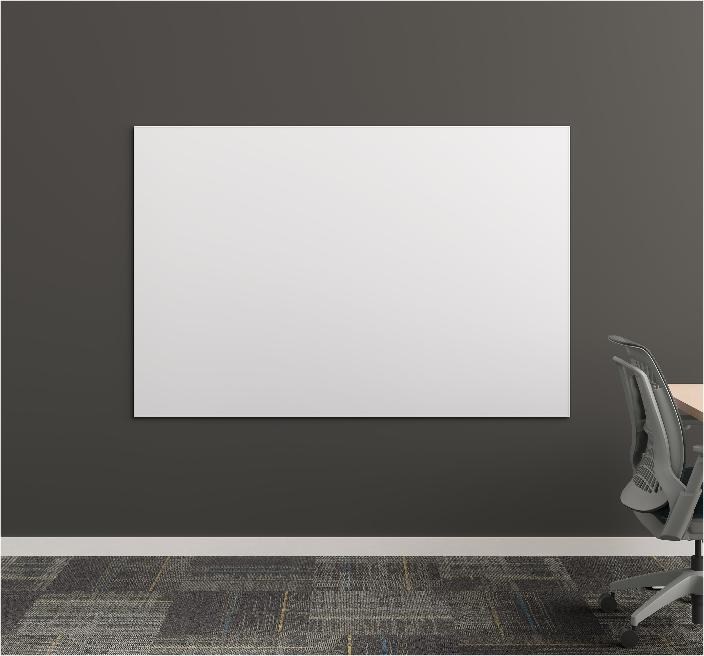 Office space with a black wall and a white porcelain Aware Wall-Hung marker board.