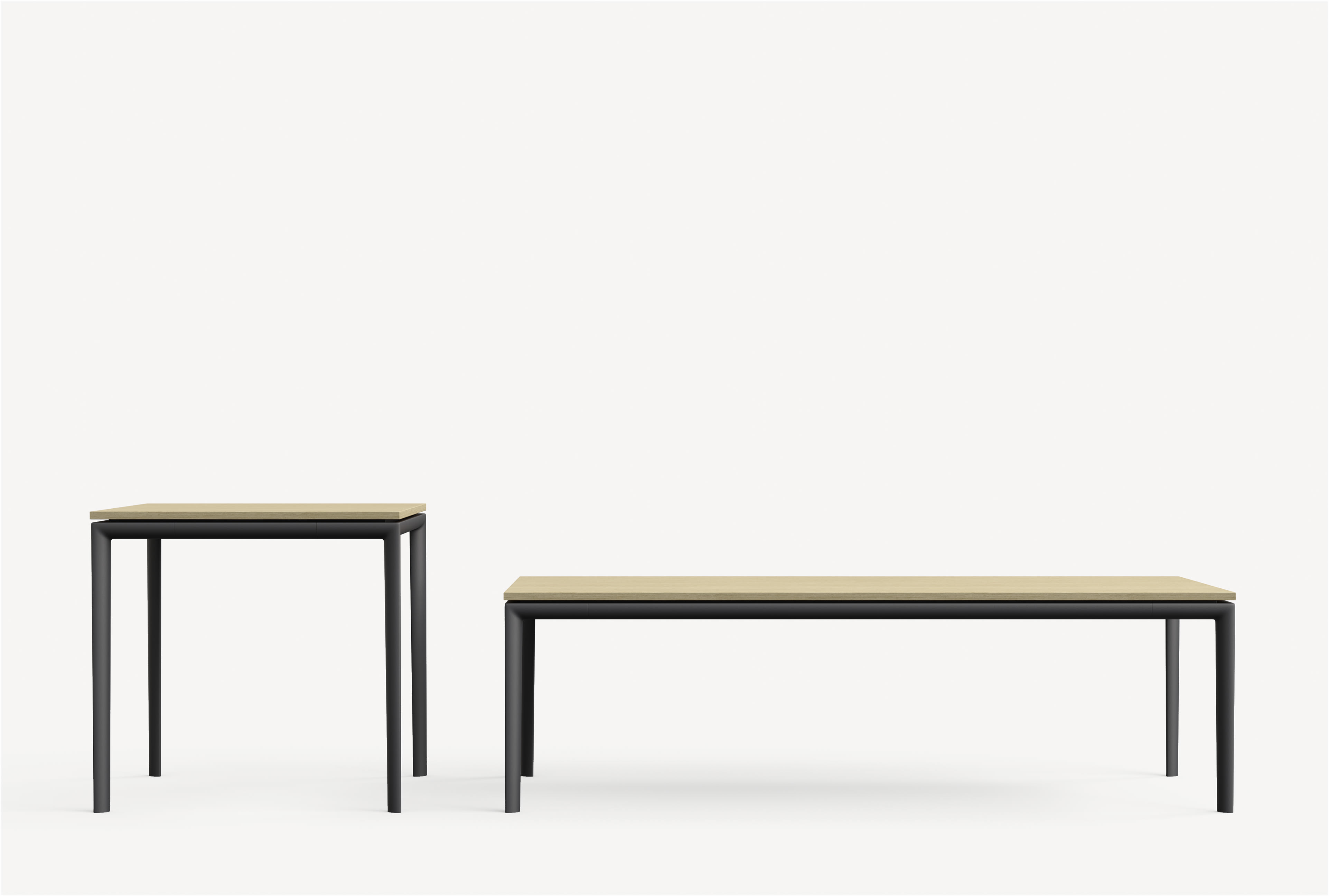 Parallel side table and a Parallel rectangular coffee table with black bases and light table tops side by side.