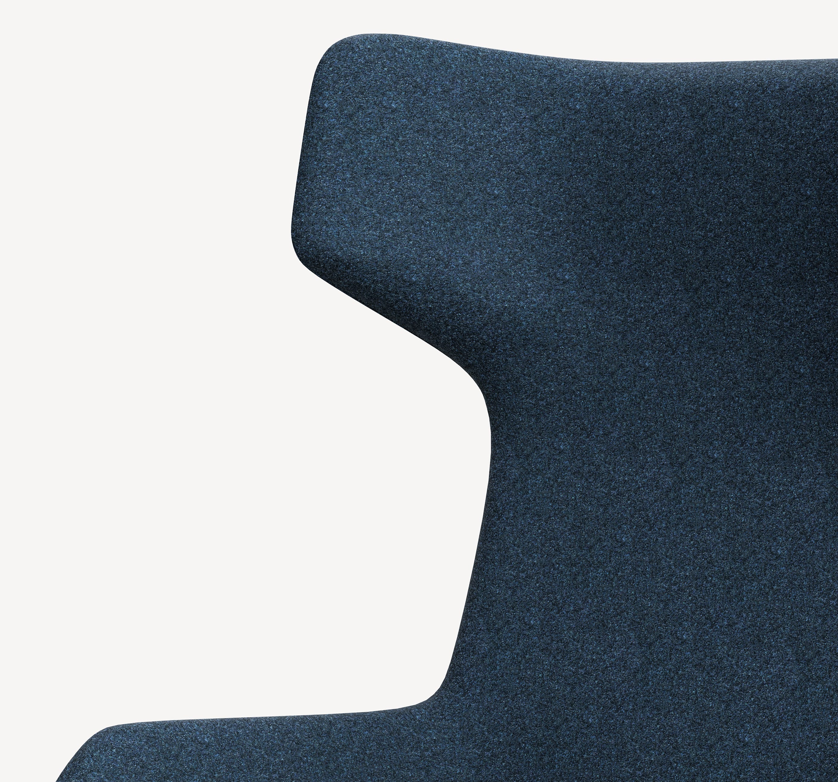 Detail of the Retreat wingback lounge chair in dark blue upholstery.