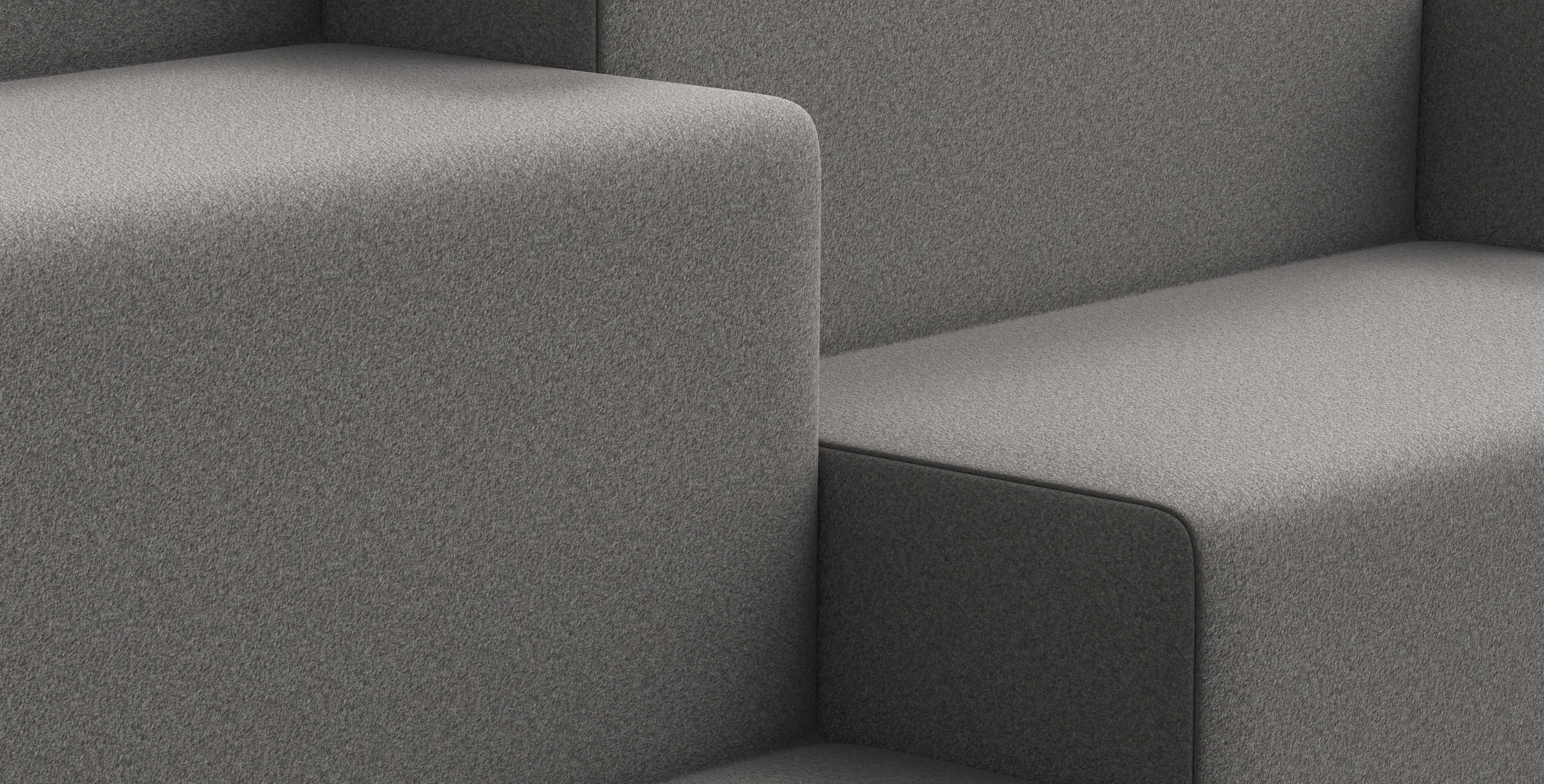 Close-up of an Allsteel Rise lounge configuration in dark grey fabric.