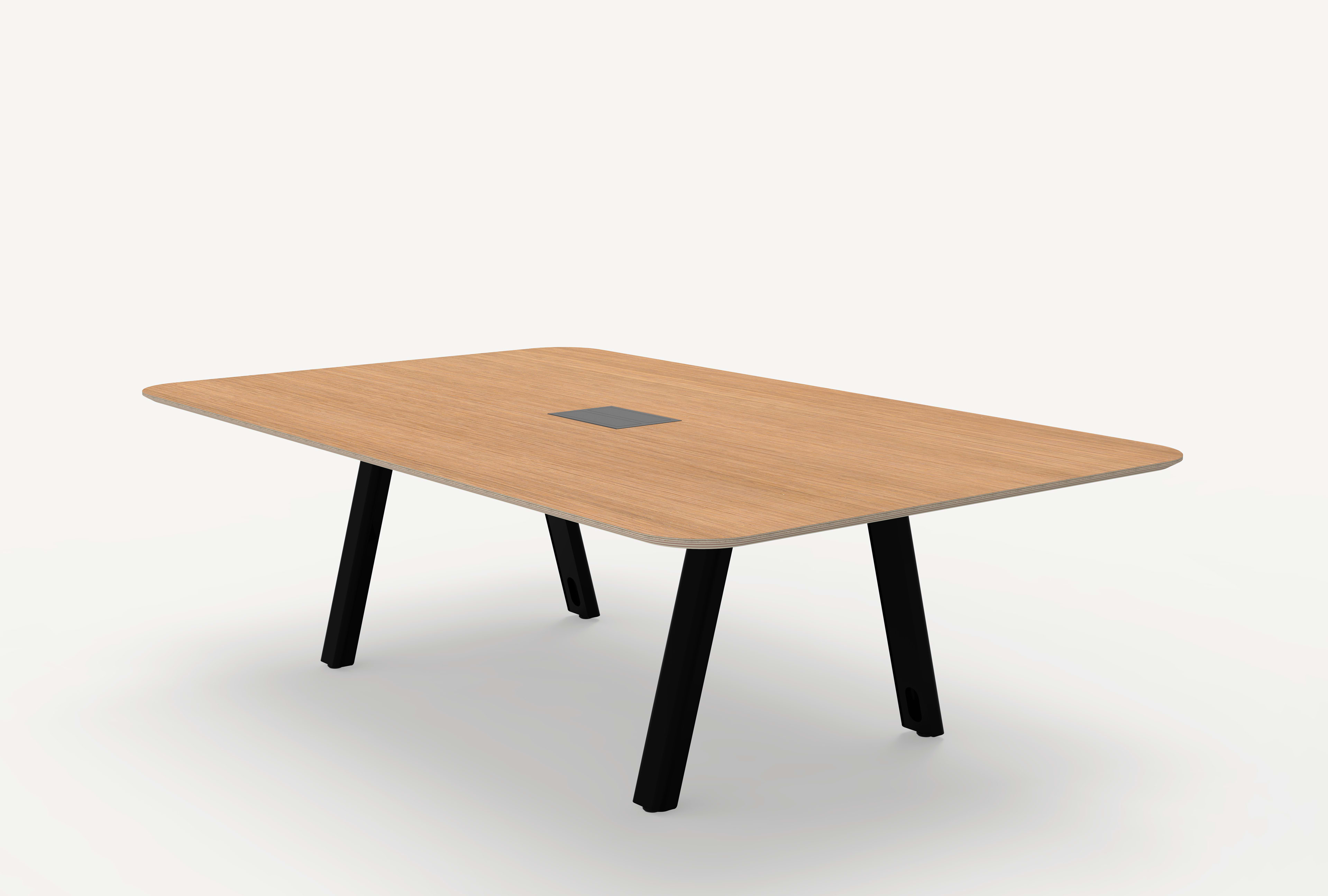 Corral Timber meeting table with black frame and light wood table top with power cut-outs.