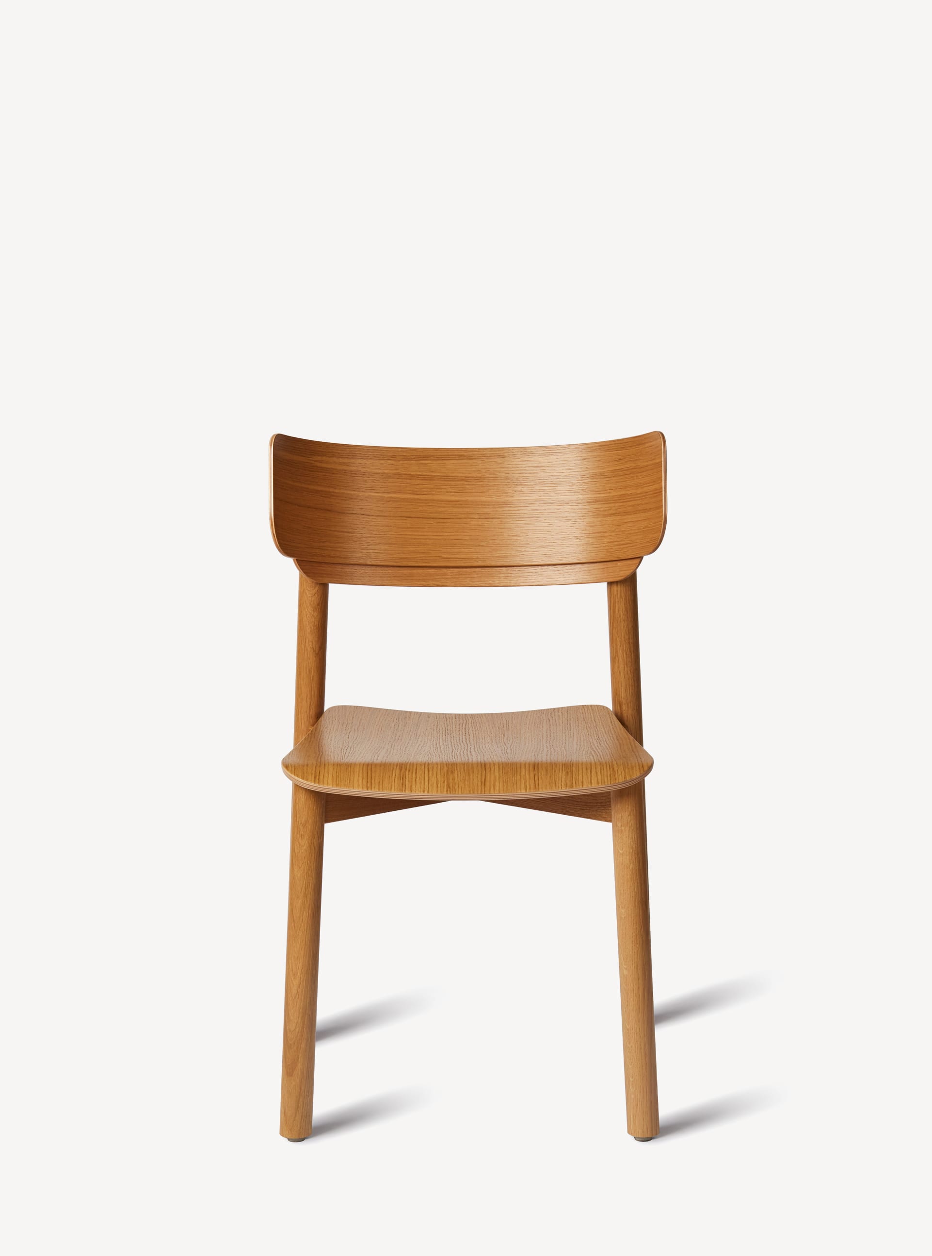 Front view of the 4-leg Corral Linden side chair in white oak wood.