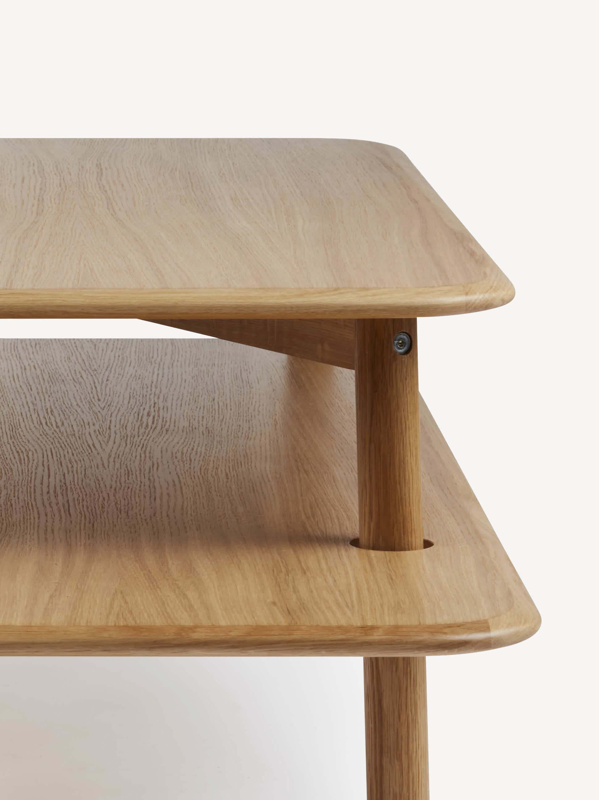 Detail view of the Corral Stacked coffee table in light oak.