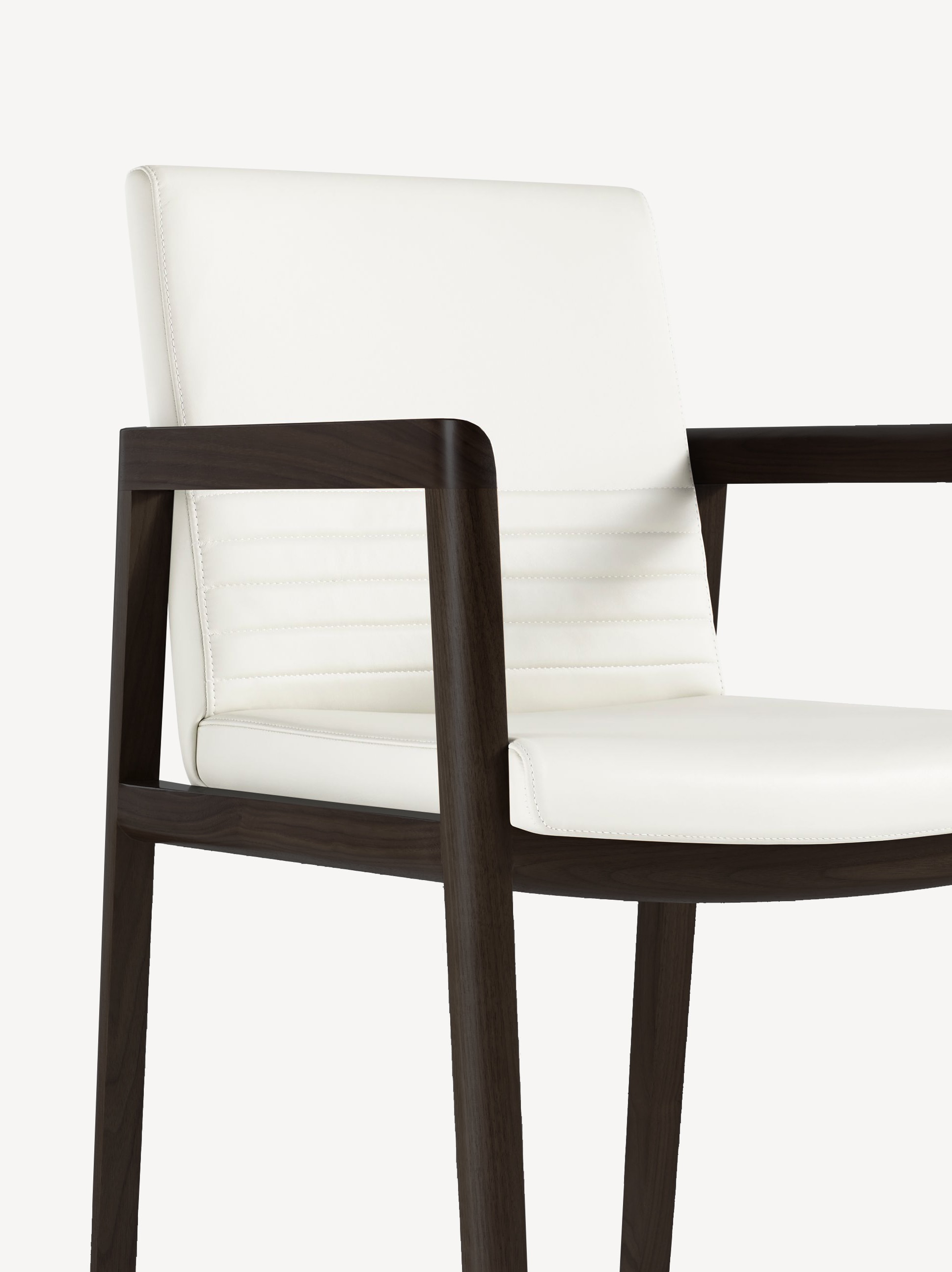 Detail view of the Lily guest chair with black wood frame and armrests and white leather upholstery.