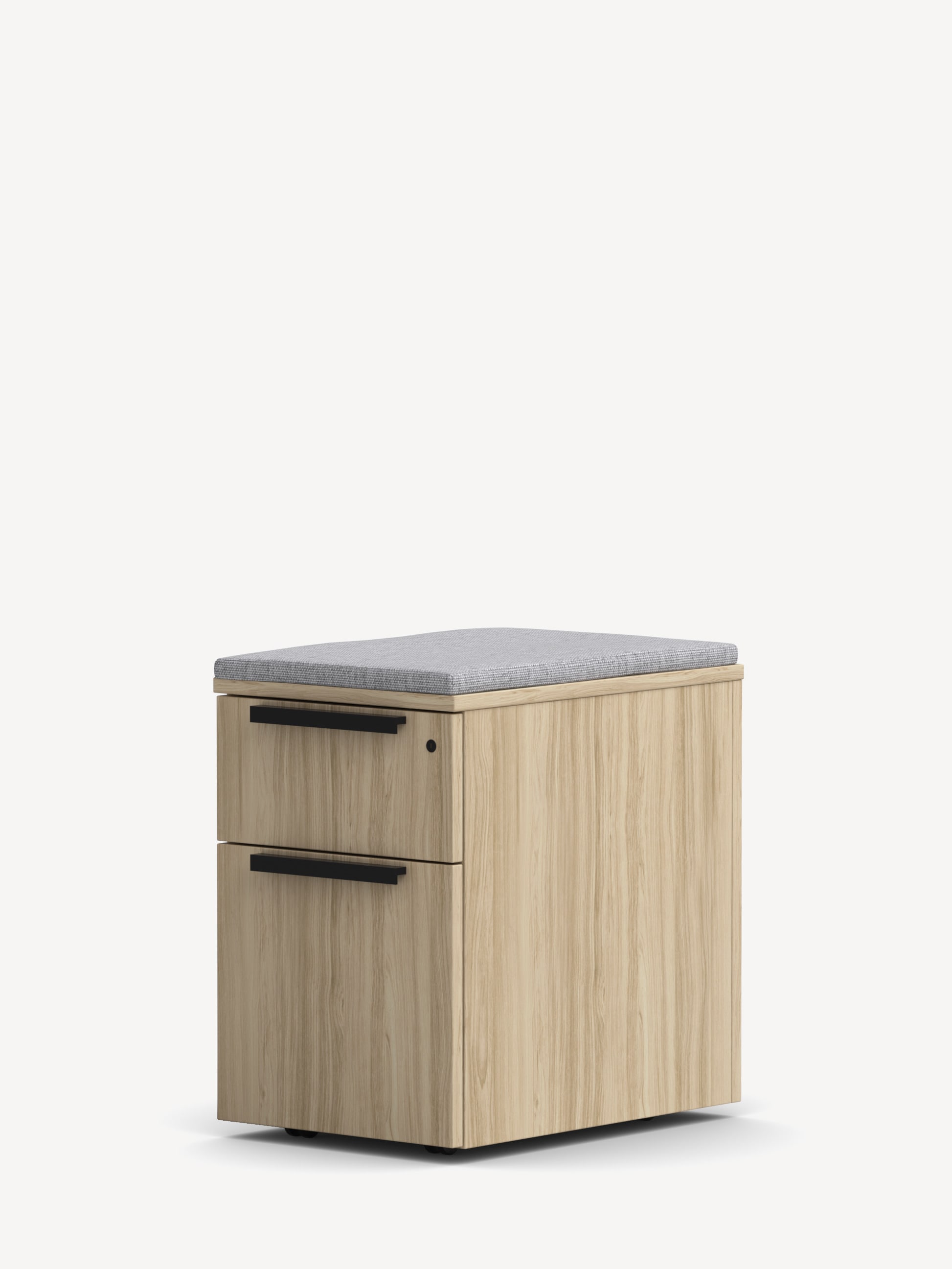 Gunlocke Mobile File Pedestal in light wood with one upper box drawer, one lower file drawer, black handles and a light grey seat cushion.