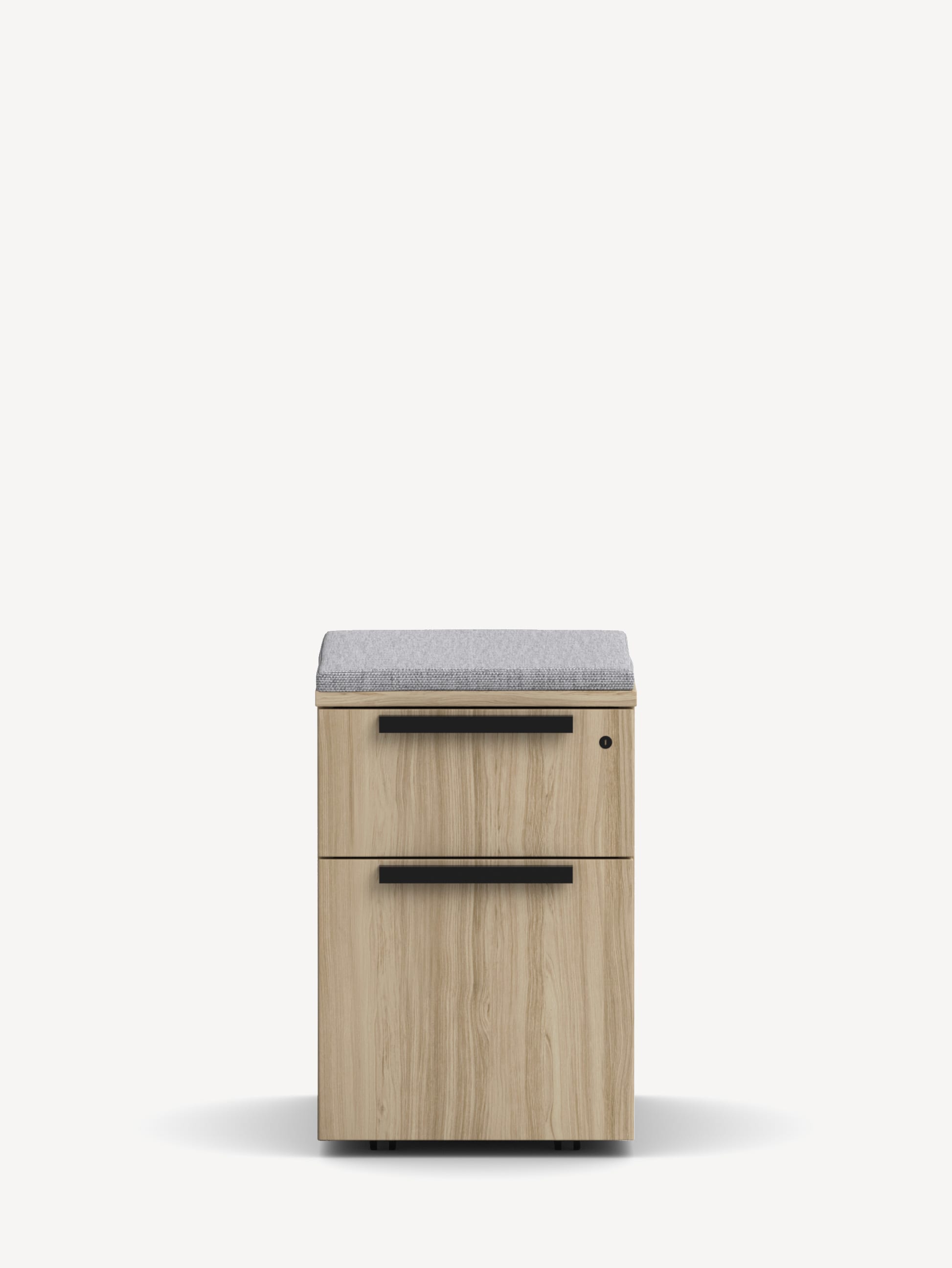 Gunlocke Mobile File Pedestal in light wood with one upper box drawer, one lower file drawer, black handles and a light grey seat cushion.