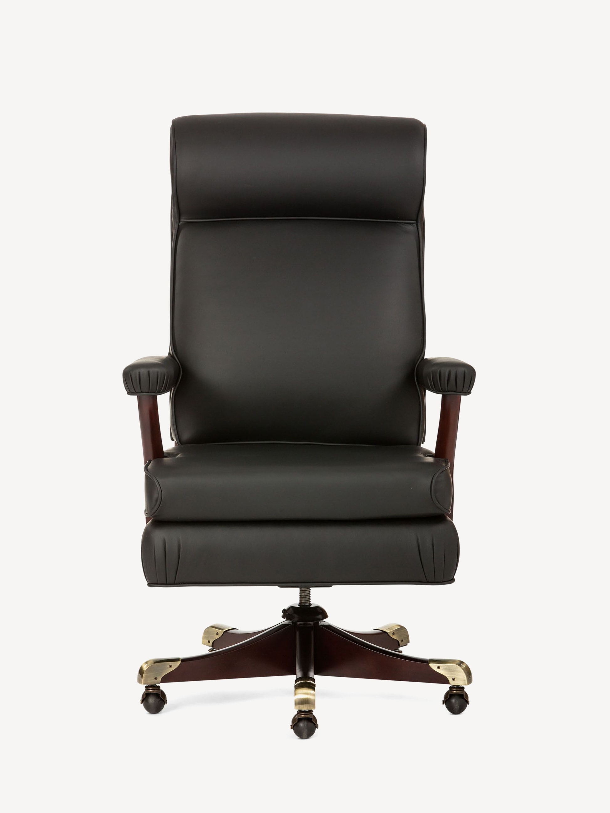 Front view of the Washington executive conference chair with black leather upholstery, gold detailing on a wood base and casters.