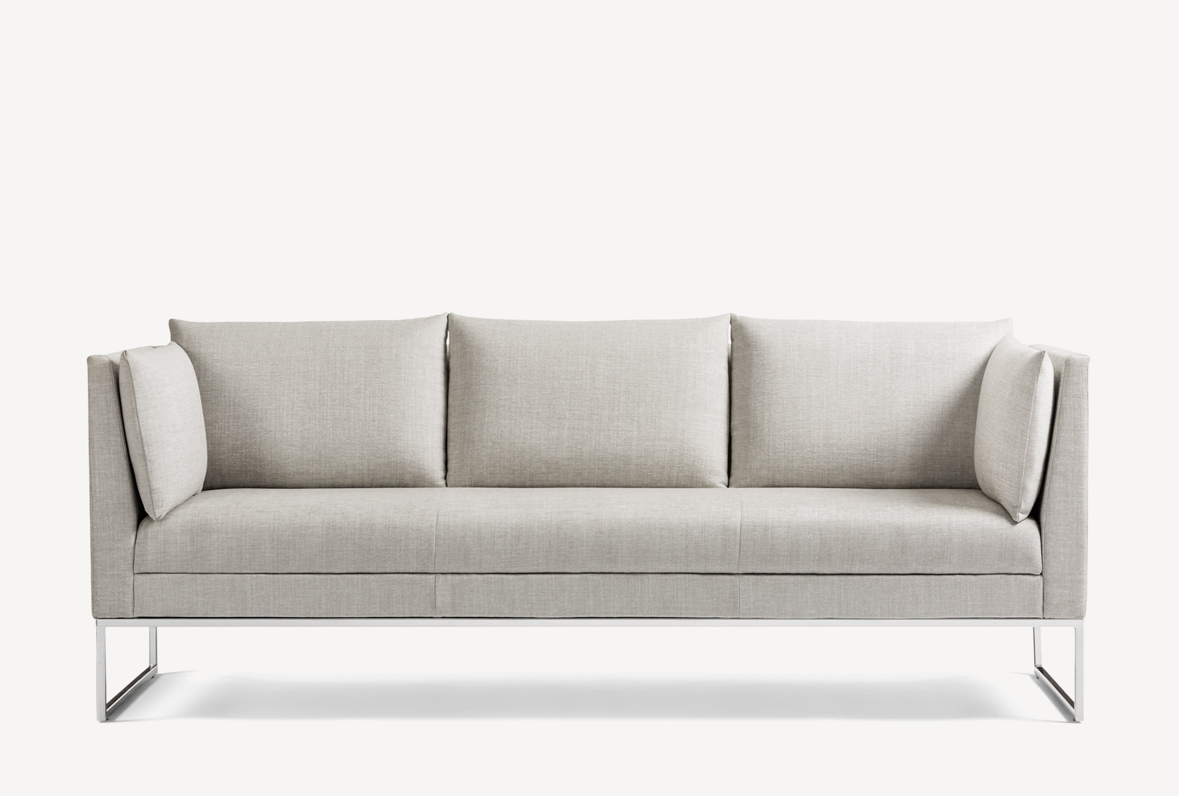 Front view of the Gunlocke Calm 3-seater sofa with silver sled base and light grey upholstery.