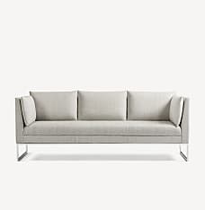 Front view of the Gunlocke Calm 3-seater sofa with silver sled base and light grey upholstery.