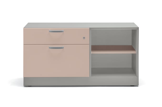 Credenza with light pink front and white surround, two drawers and two open shelves of storage.