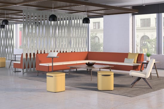 A modern and stylish office space with an orange sectional sofa, wooden accents, and a unique lighting fixture creating a visually interesting and inviting atmosphere.