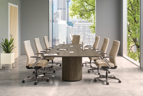 A modern and minimalist conference room with a large wooden table surrounded by white office chairs, overlooking a cityscape through the large windows.
