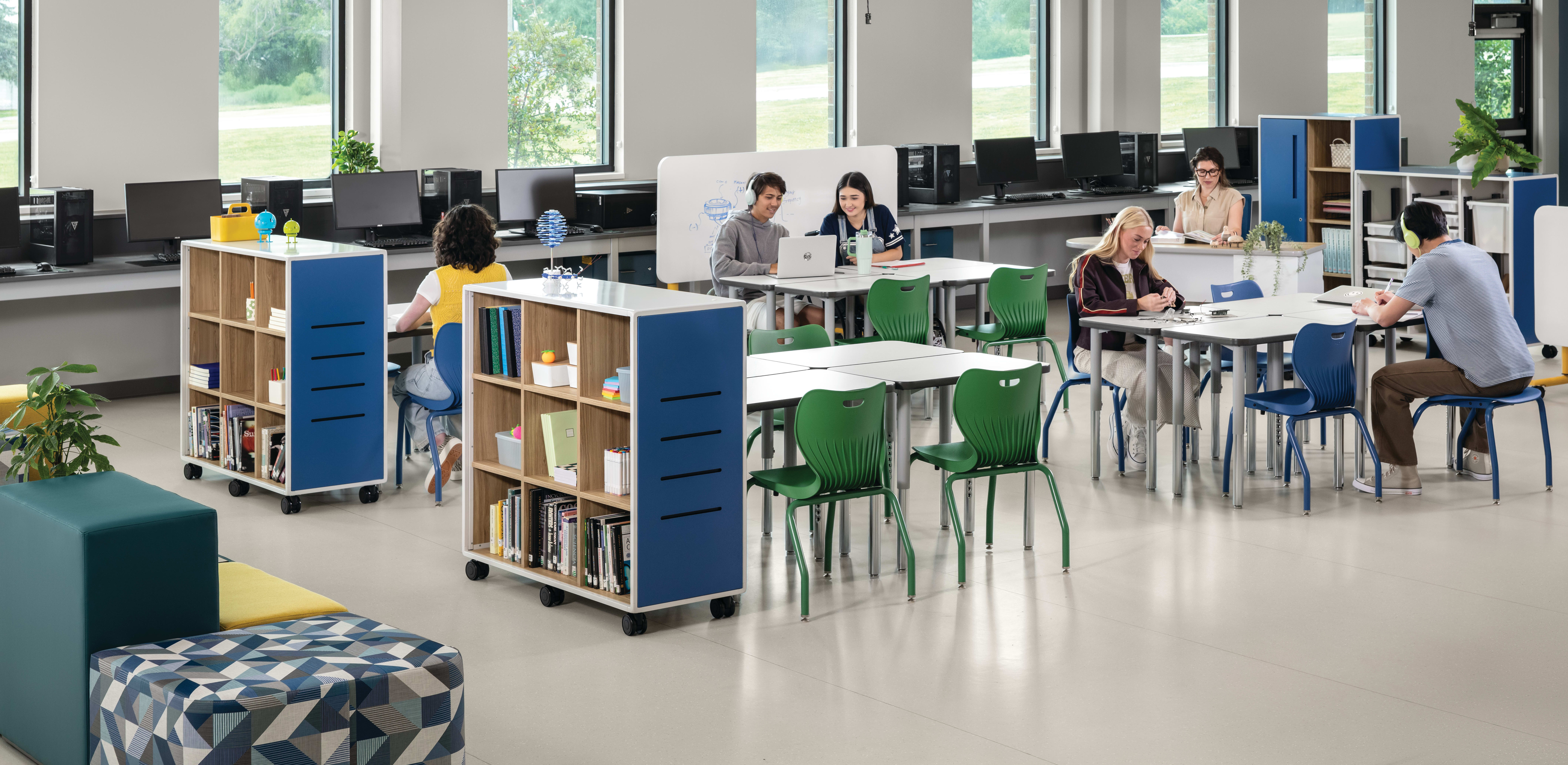 Students and teacher in a makerspace classroom with blue and green Smartlink chairs and blue Class-ifi storage solutions.