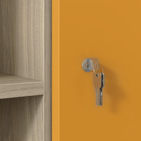Close-up of silver keys in lock on orange cabinet door with wood shelving.