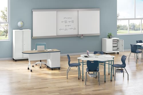 SmartLink classroom shown with teacher desk, student desks and chairs, mobile cabinets, and whiteboard.