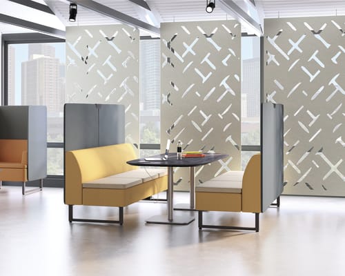 A modern and minimalist office space with yellow and gray furniture, geometric patterns on the walls, and large windows providing natural light.