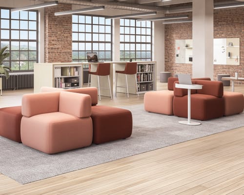 SoCo modular lounge in collaborative area with Sculpt personal tables & planter near Storage Island.