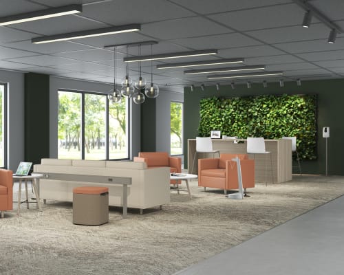 A modern and stylish office space with comfortable seating areas, a green living wall, and large windows providing natural light.