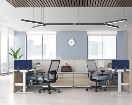 A modern and minimalist office space with sleek furniture, large windows, and a minimalist lighting fixture overhead.