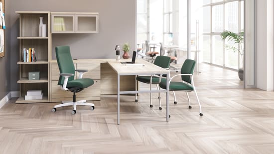 Ignition upholstered chair at 10500 Series L-shaped desk with 2 guest chairs.