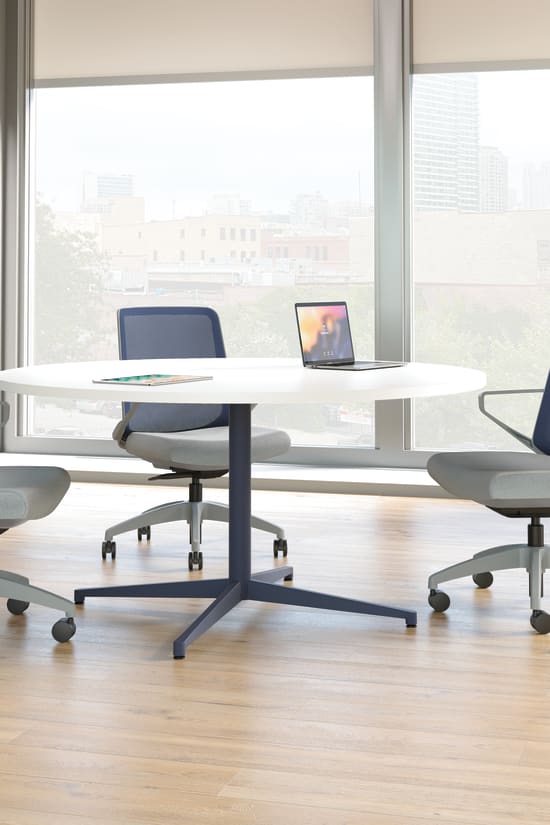 Cliq chairs with Preside round conference table.