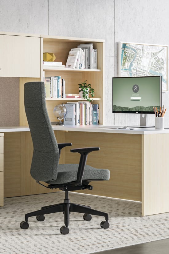 10500 Series traditional executive L-shaped desk with Cofi upholstered high-back chair.