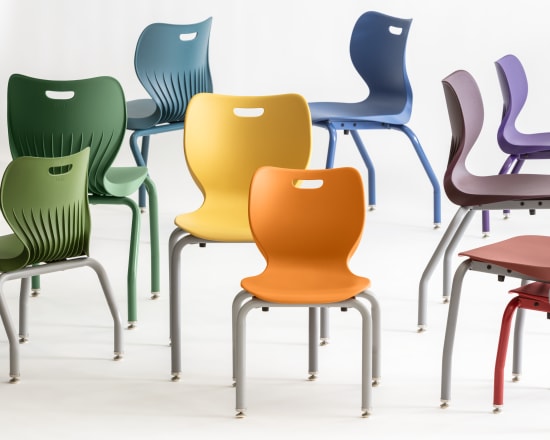 A collection of colorful, modern chairs in various shades of green, blue, yellow, and red, arranged against a plain white background.