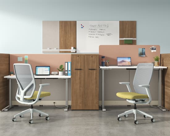 A modern and minimalist office space with desks, chairs, and various office supplies and decor elements.