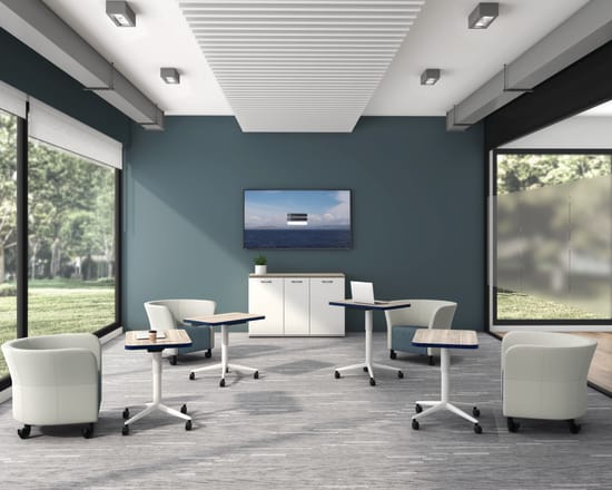 Huddle Laptop Tables with Flock Round Lounge Chairs socially distanced around a conference room.