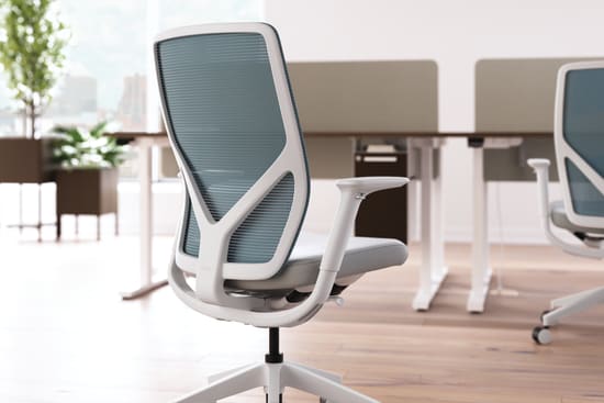 Flexion task chair with height adjustable workstations in background.