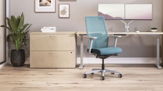 Private office featuring Mod desk with height adjustable table and Ignition task seating in blue fabric.