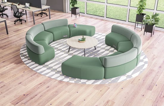 SoCo multi-fabric modular lounge in collaborative area with Scramble table and Sculpt planters near Empower workstations.