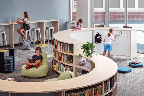 Storyline Bookcases and Bistro Tables with Confetti Floor Cushions and Lounges.