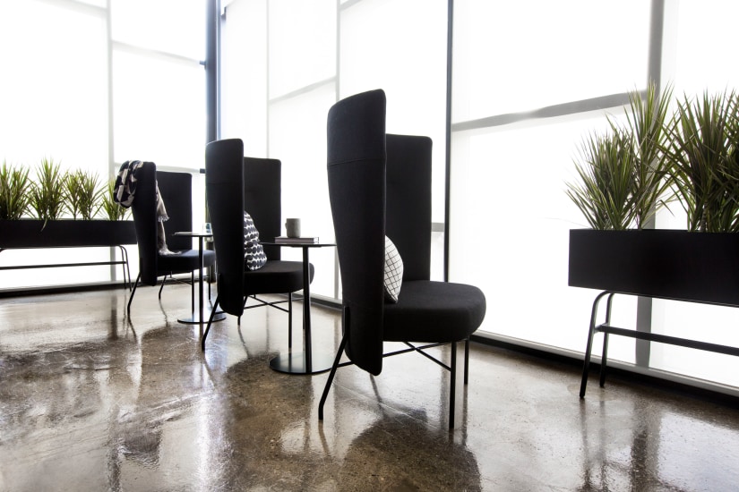 Three Wedge Chairs near Sunlit Window