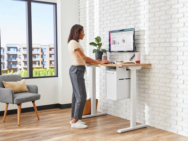White Coordinate Height-Adjustable Base paired with Coze desk top and a Fuse undermount storage