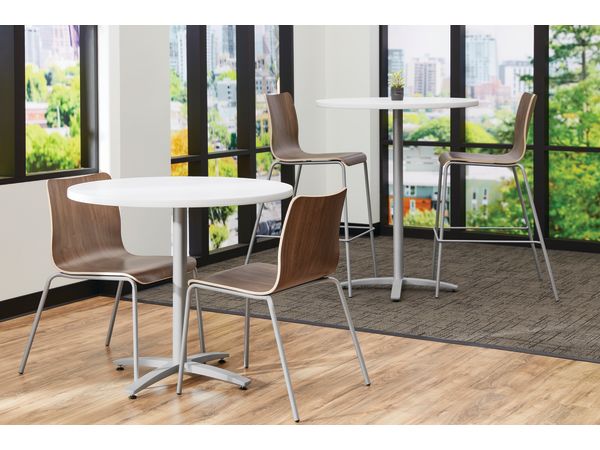 Between Standing and seated height tables with Ruck chairs in a café area