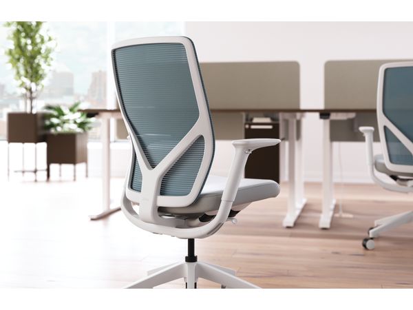 Flexion task chair with height adjustable workstations in background.
