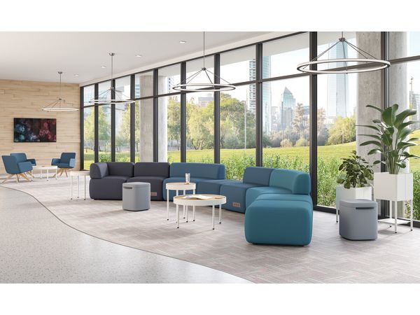 SoCo modular lounge in public space with Sculpt occasional tables & planters and Astir poufs.