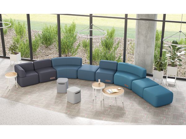 SoCo modular lounge in public space with Sculpt occasional tables & planters and Astir poufs.