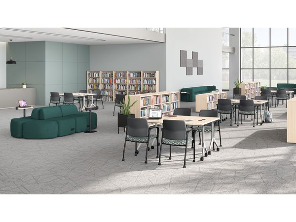 A multi-media center setting featuring SoCo seating, Ignition guest chairs, and Motivate tables.