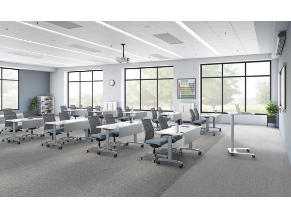 A classroom setting featuring Ignition task seating and Huddle training tables.