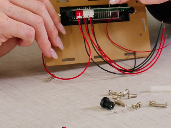 Vertical 9 x 16 video of students and a teacher in a makerspace classroom with blue and green Smartlink chairs and blue Class-ifi storage solutions.